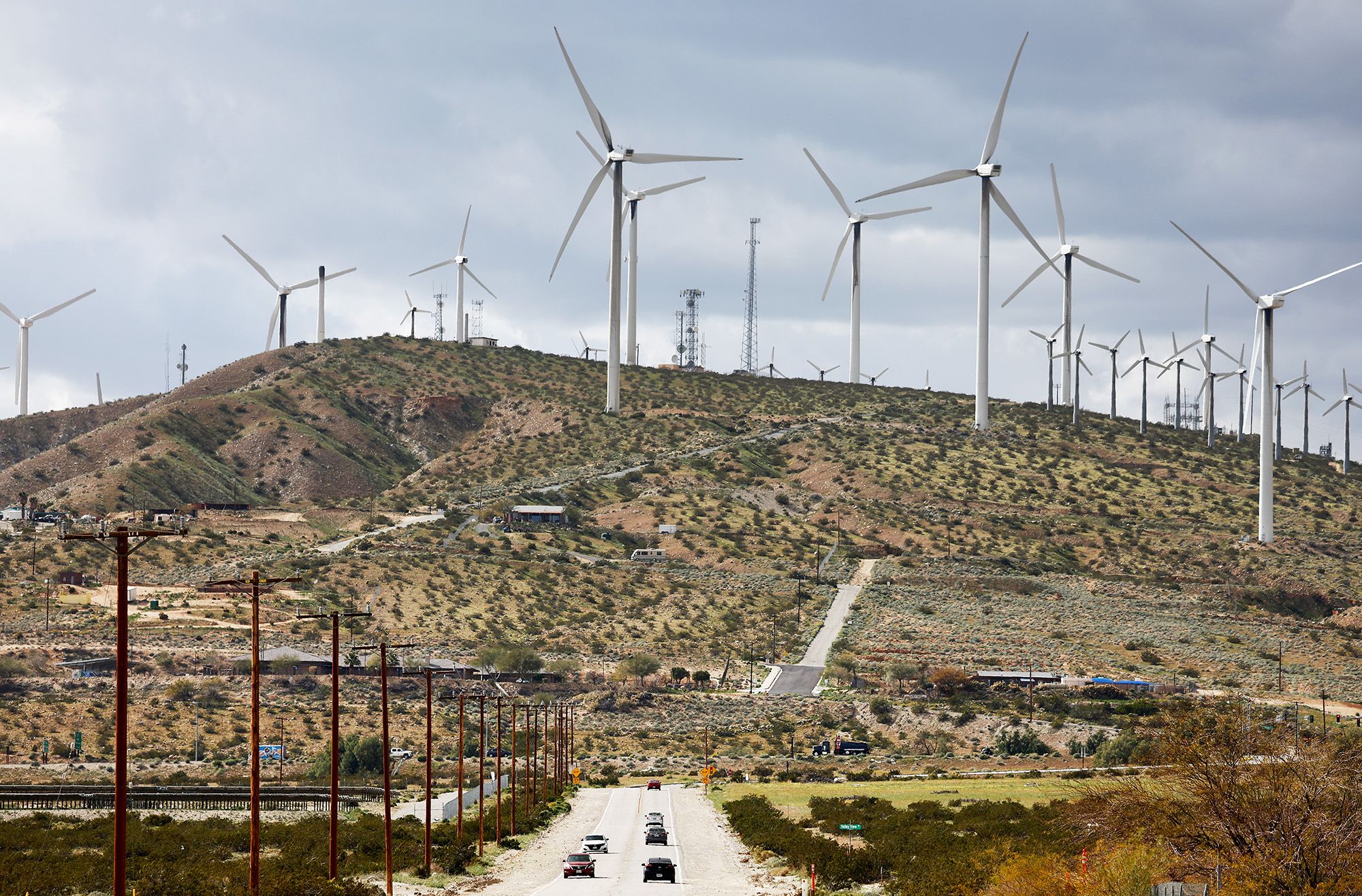 WHITEWATER, CALIFORNIA - FEBRUARY 22: Wind turbines operate at a wind farm, a key power source for the Coachella Valley, as vehicles drive on February 22, 2023 near Whitewater, California. Wind turbines in California provide enough energy to power more than 2 million homes while the International Energy Agency (IEA) predicts renewable energy will account for 35 percent of worldwide power generation in 2025. (Photo by Mario Tama/Getty Images)