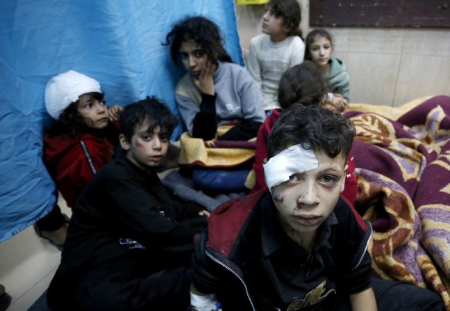 Injured Palestinians, including children, are taken to Al-Aqsa Martyrs Hospital for treatment after Israeli attacks hit the school at Al Bureij Refugee Camp in Deir Al Balah, Gaza, on Monday, November 20.
