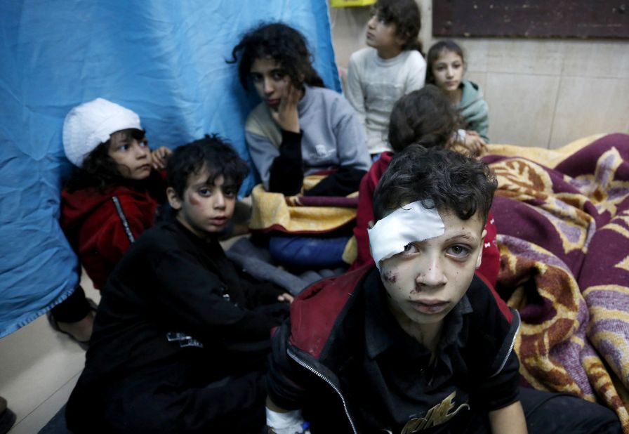 Injured Palestinians, including children, are taken to Al-Aqsa Martyrs Hospital for treatment after Israeli attacks hit the school at Al Bureij Refugee Camp in Deir Al Balah, Gaza, on November 20.