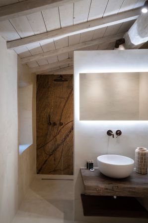 <strong>Beautiful bath: </strong>A neutral palette showcases the building's rustic roots.