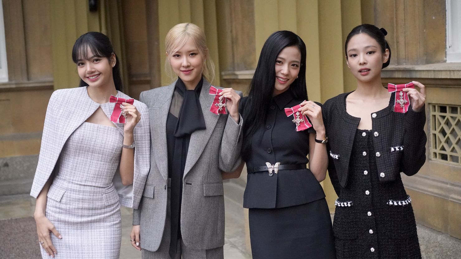 (left to right) Lisa (Lalisa Manoban), Rose (Roseanne Park), Jisoo Kim and Jennie Kim, from the K-Pop band Blackpink pose with their Honorary MBEs (Members of the Order of the British Empire), awarded to them in recognition of the band's role as COP26 advocates for the COP26 Summit in Glasgow 2021 on November 22, 2023 in London, England. King Charles III conducted the special Investiture ceremony in the presence of the President of South Korea, Yoon Suk Yeol, and his wife, Kim Keon Hee.