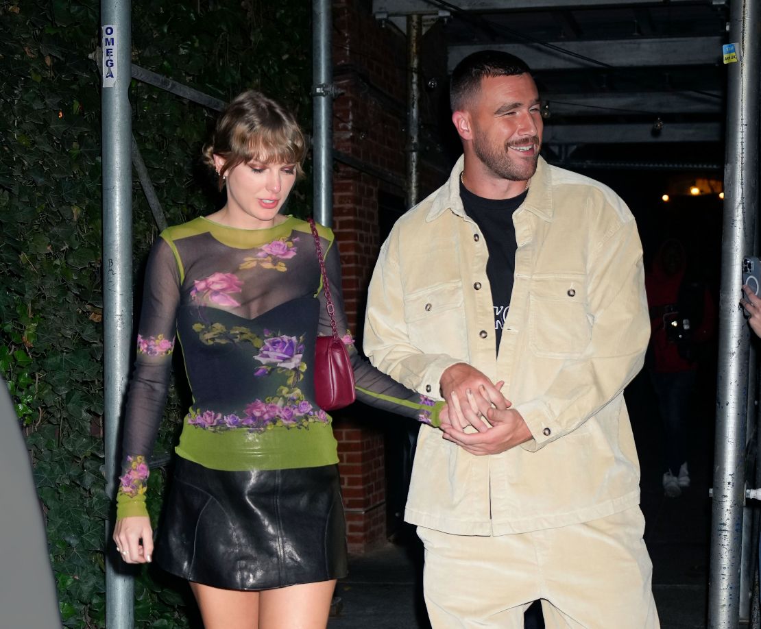 (From left) Taylor Swift and Travis Kelce holding hands in New York City in October. 