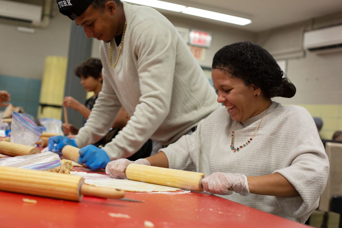 Franklin Jose Rivero and Lucelys Garcia help make pies for the homeless at Robert F. Wagner Middle School in New York City, on November 18.