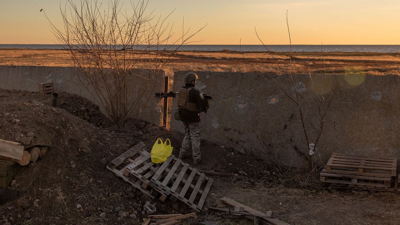 A Ukrainian serviceman of the 123rd Territorial Defense Brigade stands guard on a position next to the Dnipro River, in an undisclosed location in the Kherson region, on November 6, 2023, amid the Russian invasion of Ukraine. While Ukraine's recapture of Kherson city last November was a shock defeat for the Kremlin, Russian forces on the opposing bank still control swathes of territory and shell towns and villages they retreated from. The Dnipro, Europe's fourth-longest river and a historic trading route, has become a key front since Ukrainian troops pushed Russian forces back over its banks in the south last year. (Photo by Roman PILIPEY / AFP) (Photo by ROMAN PILIPEY/AFP via Getty Images)