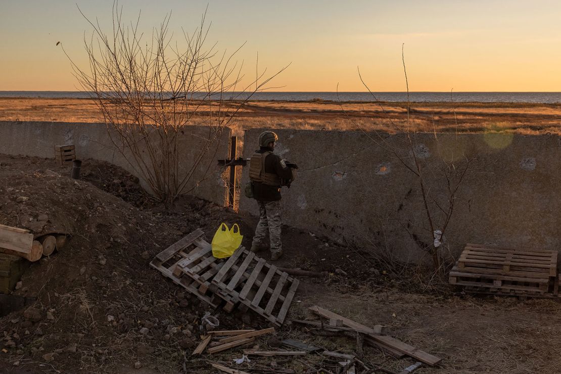 A Ukrainian serviceman of the 123rd Territorial Defense Brigade stands guard on a position next to the Dnipro River, in an undisclosed location in the Kherson region, on November 6, 2023, amid the Russian invasion of Ukraine. While Ukraine's recapture of Kherson city last November was a shock defeat for the Kremlin, Russian forces on the opposing bank still control swathes of territory and shell towns and villages they retreated from. The Dnipro, Europe's fourth-longest river and a historic trading route, has become a key front since Ukrainian troops pushed Russian forces back over its banks in the south last year. (Photo by Roman PILIPEY / AFP) (Photo by ROMAN PILIPEY/AFP via Getty Images)