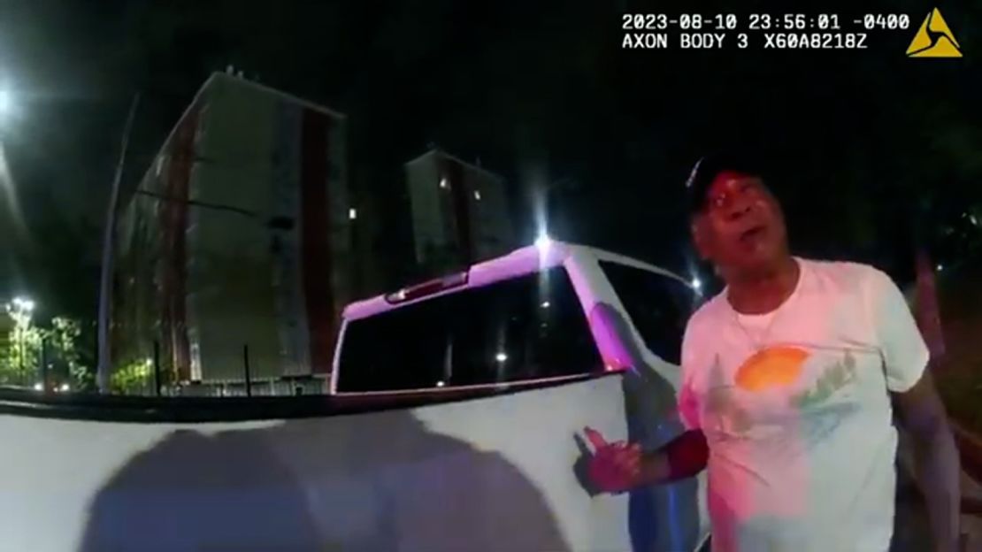 This image from bodycam video provided by the Atlanta Police Department shows Johnny Hollman Sr. speaking with Officer Kiran Kimbrough on August 10, 2023 in Atlanta.