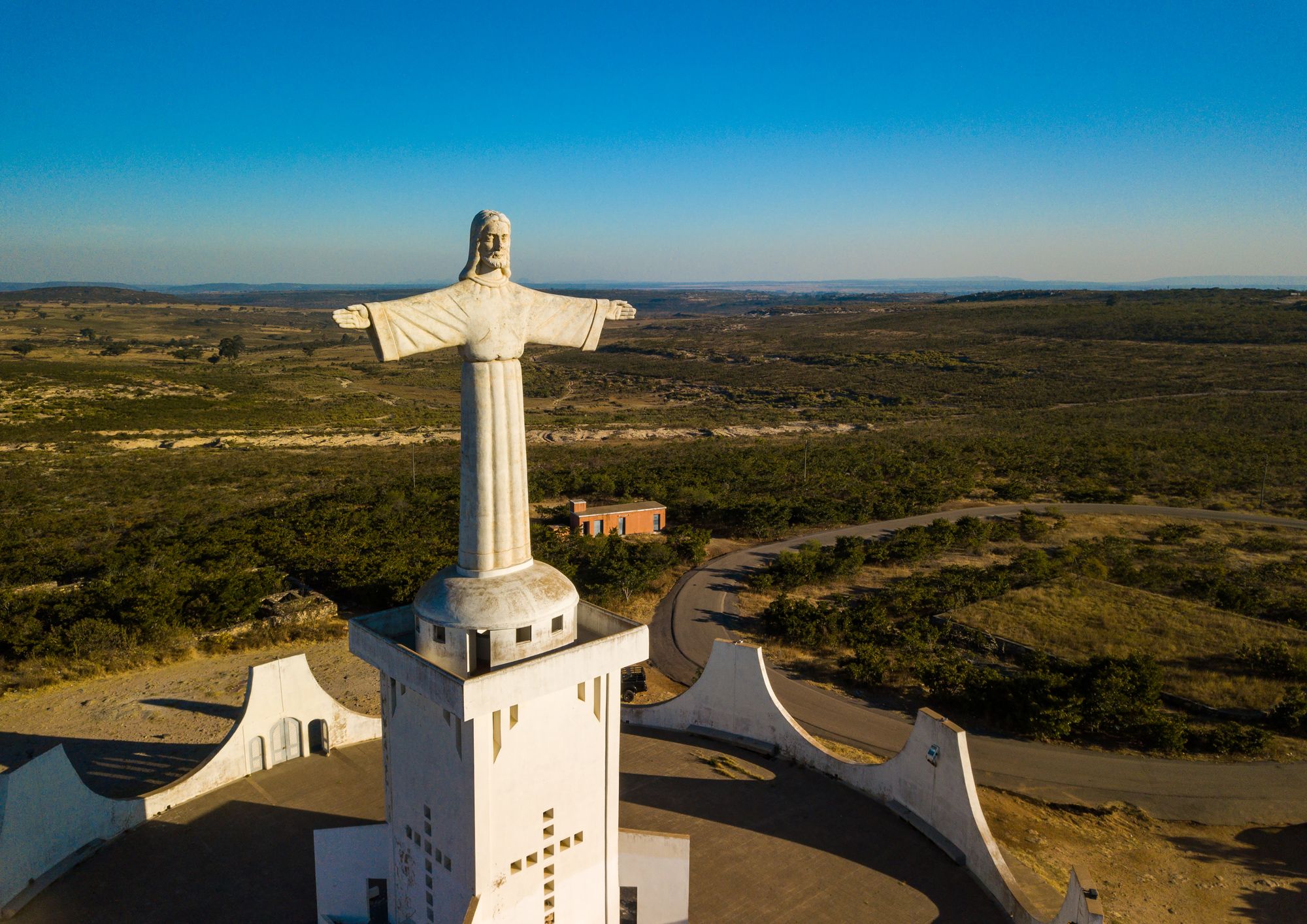 LUBANGO, ANGOLA - JULY 20: Aerial view of the Cristo Rei, Huila Province, Lubango, Angola on July 20, 2018 in Lubango, Angola. (Photo by Eric Lafforgue/Art In All Of Us/Corbis via Getty Images)
