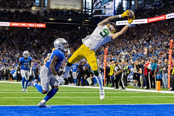 Christian Watson of the Green Bay Packers makes a catch for a touchdown during a game against the Detroit Lions on November 23. The Packers beat the Lions 29-22.