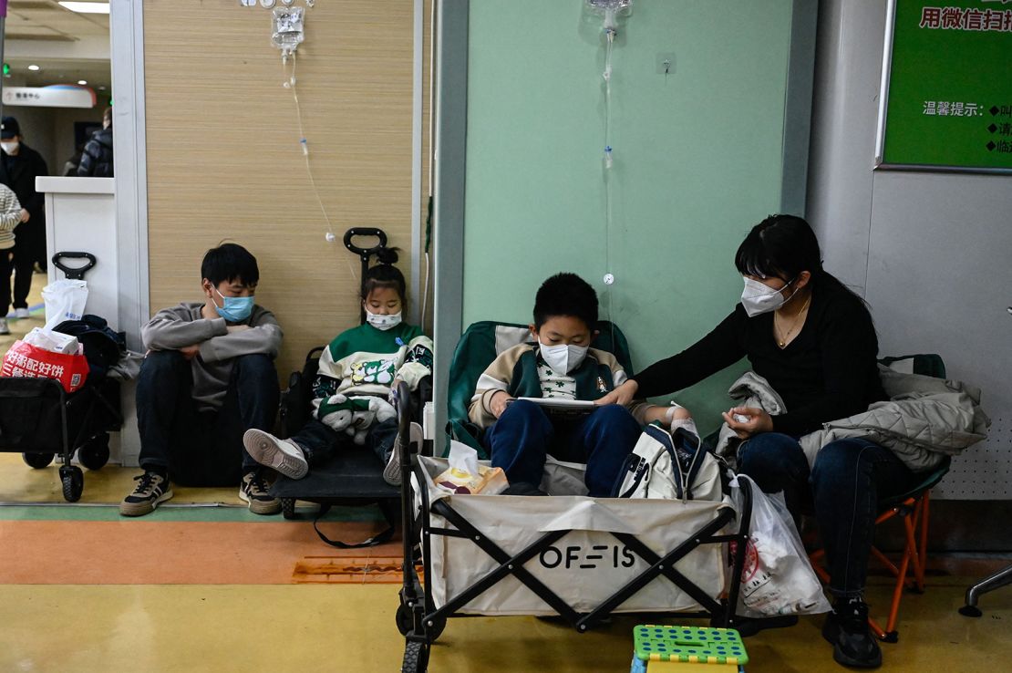 Children receive a drip at a children hospital in Beijing on November 23, 2023.