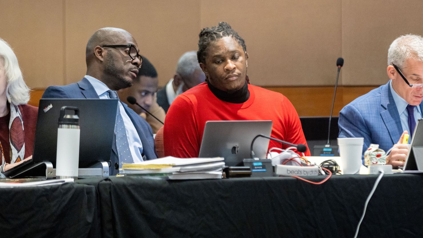 Atlanta rapper Young Thug, center, is seen in court during the ongoing ''Young Slime Life'' gang trial in Atlanta, on Tuesday, Oct. 31, 2023.