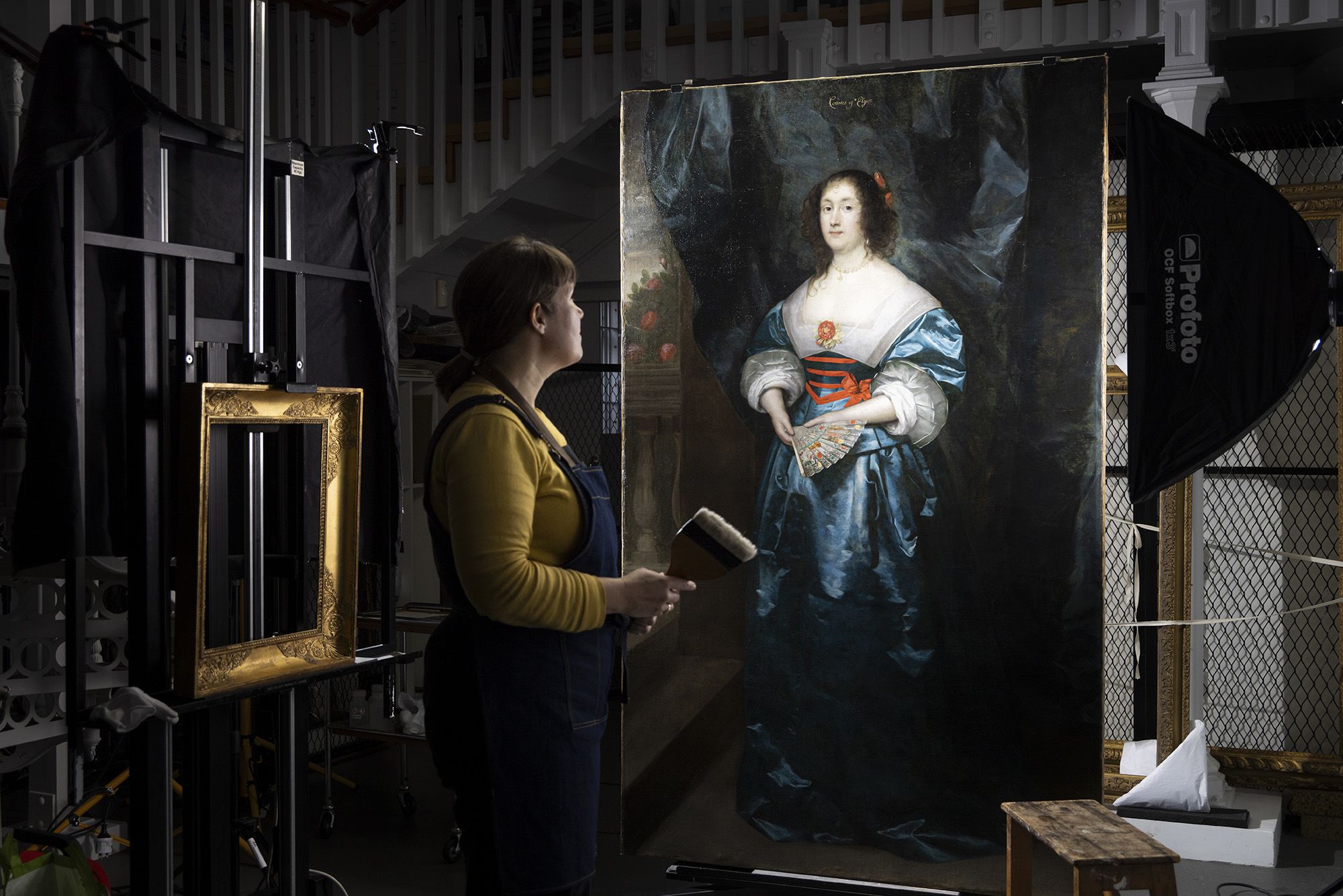 EMBARGOED 00.01 FRIDAY 24 NOVEMBER: English Heritage's paintings expert Alice Tate-Harte finishes conserving a painting of 17th-century noblewoman, Diana Cecil, as the charity revealed her true face after centuries of overpainting had hidden her features. During the conservation, it was discovered that much later re-touching had given Diana the Hollywood treatment, plumping her lips and lowering her hairline. After hours of painstaking conservation, Alice has removed the yellowing layer of old varnish to reveal Diana's true colours, as well as revealing her lips and hair as they were originally painted. Also revealed was the portrait's date of 1634 and the signature of artist Cornelius Johnson. The portrait of Diana Cecil goes on display at Kenwood, a neoclassical villa in London, on 30 November.