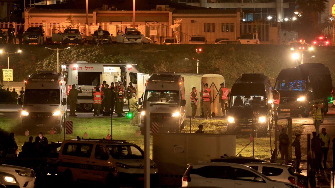 Israeli security forces stand next to ambulances waiting outside the helipad of Tel Aviv's Schneider medical centre on November 24, 2023, amid preparations for the release of Israeli hostages held by Hamas in Gaza in exchange for Palestinian prisoners later in the day. After 48 days of gunfire and bombardment that claimed thousands of lives, a four-day truce in the Israel-Hamas war began on November 24 with 50 hostages set to be released in exchange for 150 Palestinian prisoners. (Photo by FADEL SENNA / AFP) (Photo by FADEL SENNA/AFP via Getty Images)