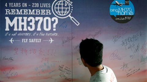 A man looks at a message board for passengers, onboard the missing Malaysia Airlines Flight MH370, during its fourth annual remembrance event in Kuala Lumpur, Malaysia March 3, 2018. REUTERS/Lai Seng Sin
