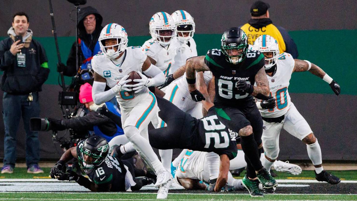 Miami Dolphins safety Jevon Holland (8) runs after intercepting a pass during second quarter of an NFL football game against the New York Jets at MetLife Stadium on Friday, Nov. 24, 2023, in East Rutherford, New Jersey. (David Santiago/Miami Herald/TNS/ABACAPRESS.COM