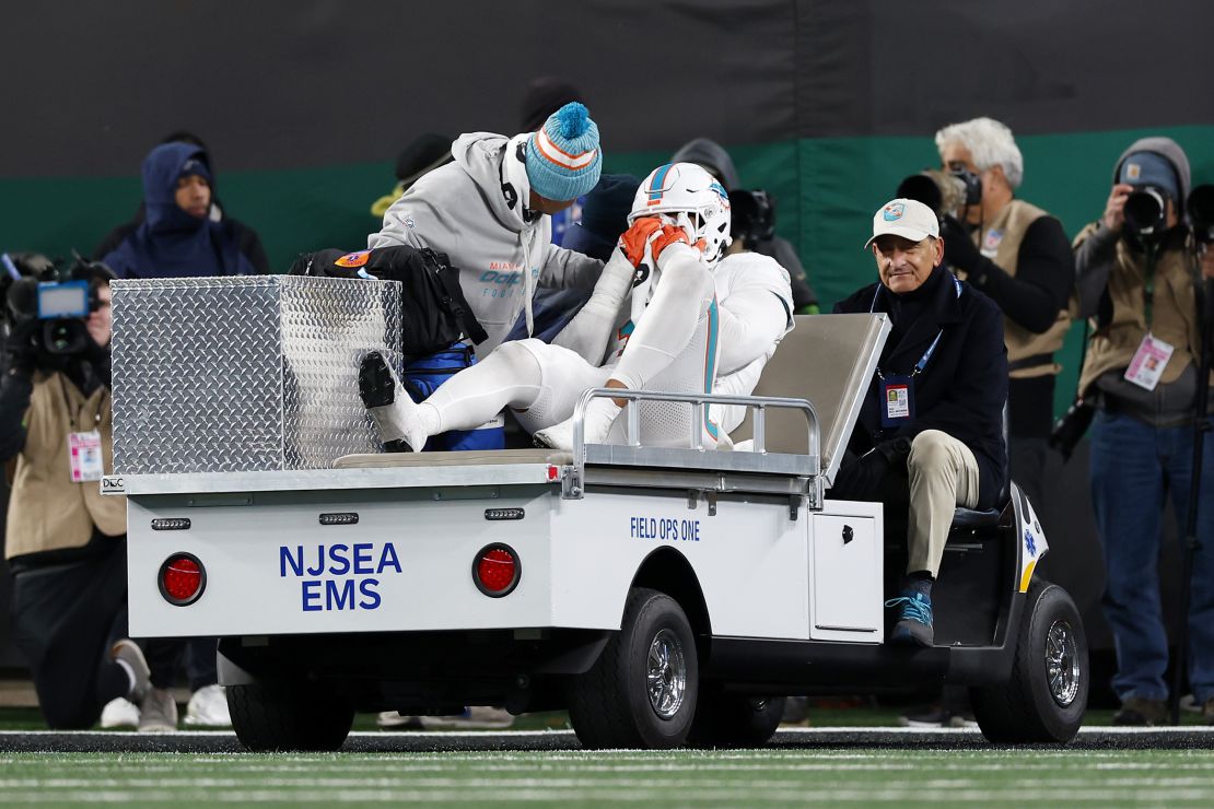 EAST RUTHERFORD, NEW JERSEY - NOVEMBER 24: Jaelan Phillips #15 of the Miami Dolphins is carted off the field after being injured in a play against the New York Jets during the fourth quarter in the game at MetLife Stadium on November 24, 2023 in East Rutherford, New Jersey.