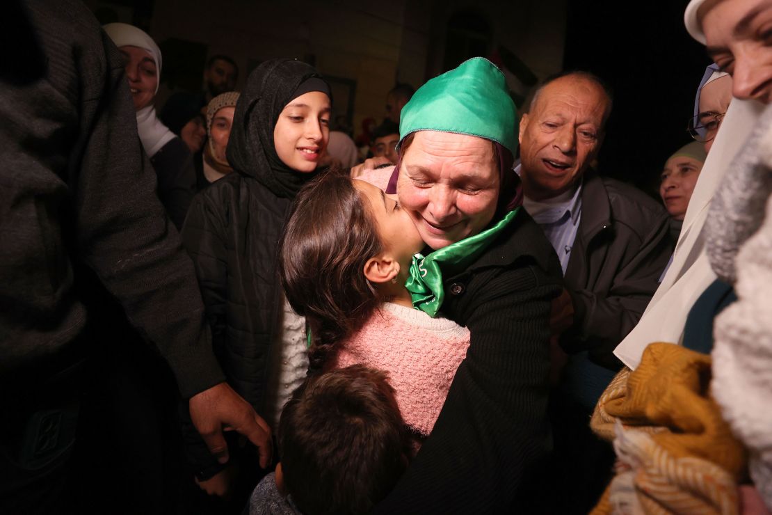 RAMALLAH, WEST BANK - NOVEMBER 24: Released Palestinian prisoners, arrive to Beitunia, west of Ramallah, with International Red Cross vehicles under the agreement on the four-day humanitarian pause in Ramallah, West Bank on November 24, 2023. Israel released 39 Palestinians; 24 women and 15 children, from Ofer Prison, as part of an exchange deal. (Photo by Issam Rimawi/Anadolu via Getty Images)