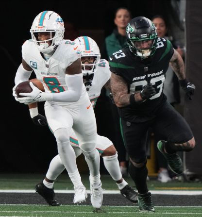 Miami Dolphins safety Jevon Holland runs the ball after intercepting New York Jets quarterback Tim Boyle's Hail Mary pass on the 1-yard line on Friday, November 24. Holland <a href="index.php?page=&url=https%3A%2F%2Fwww.cnn.com%2F2023%2F11%2F25%2Fsport%2Fmiami-dolphins-new-york-jets-nfl-spt-intl%2Findex.html" target="_blank">ran it to the other end of the field</a>, weaving through the scrambled defense, for an astonishing 99-yard interception touchdown. The Dolphins beat the Jets 34-13.