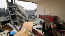 A Palestinian woman sits on debris in her damaged apartment in the Khezaa district on the outskirts of the southern Gazan city of Khan Younis, as a temporary truce between Israel and Hamas entered its second day on November 25. Mahmud Hams/AFP/Getty Images