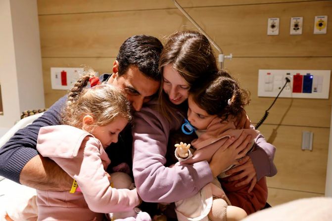 Members of the Asher family embrace each at Schneider Children's Medical Center in Petah Tikva, Israel on Friday, November 24. Sisters Aviv and Raz and their mother, Doron, were released on the first day of the truce between Israel and Hamas.