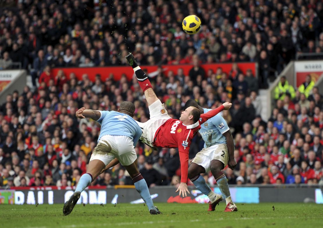 30 Years of The Premier League Package. File photo dated 12-02-2011 of Manchester United's Wayne Rooney (centre). Just 12 minutes remained of a Manchester derby at Old Trafford when Nani's cross took a slight deflection off the back of Pablo Zabaleta. Wayne Rooney had to reposition himself near the penalty spot before beating City's goalkeeper Joe Hart with an acrobatic overhead-kick. Issue date: Friday August 12, 2022. See PA story SOCCER Premier League Moments. Photo credit should read Martin Rickett/PA Wire. URN:68273926 (Press Association via AP Images)