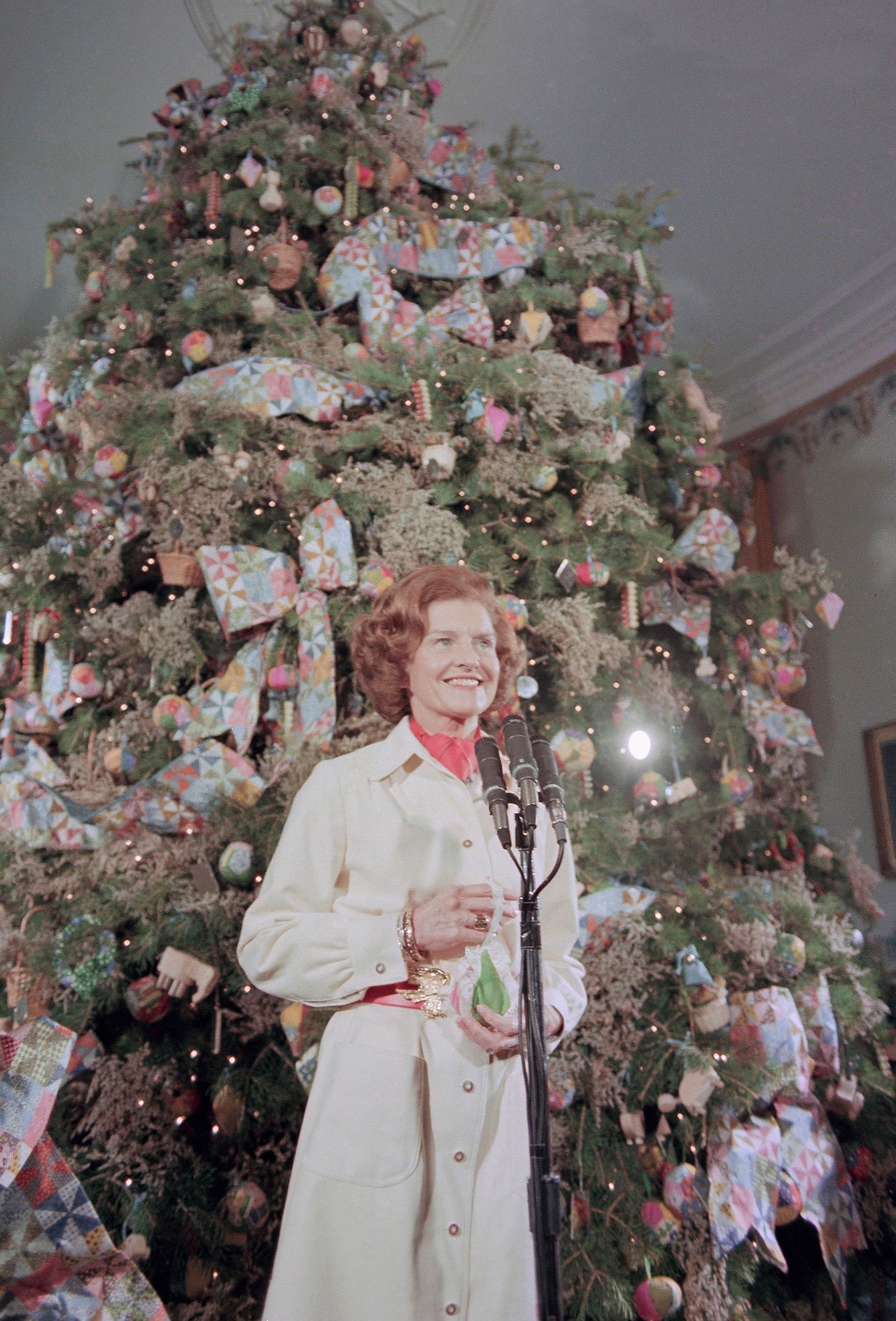 Betty Ford poses in front of the White House Christmas tree in Washington on Dec. 10, 1974. (AP Photo)