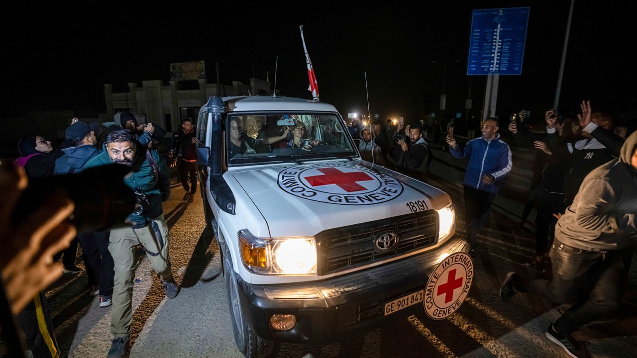 A Red Cross convoy carrying Israeli and foreign hostages heads to Egypt from the Gaza Strip at the Rafah border crossing on Sunday, Nov. 26, 2023