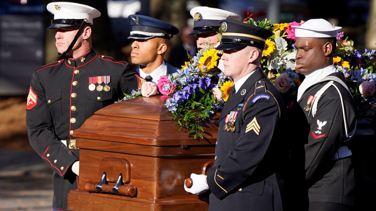 A military team carries the casket of former first lady Rosalynn Carter upon arrival at the Jimmy Carter Presidential Library and Museum, Monday, Nov. 27, 2023, in Atlanta. (AP Photo/Mike Stewart, Pool)