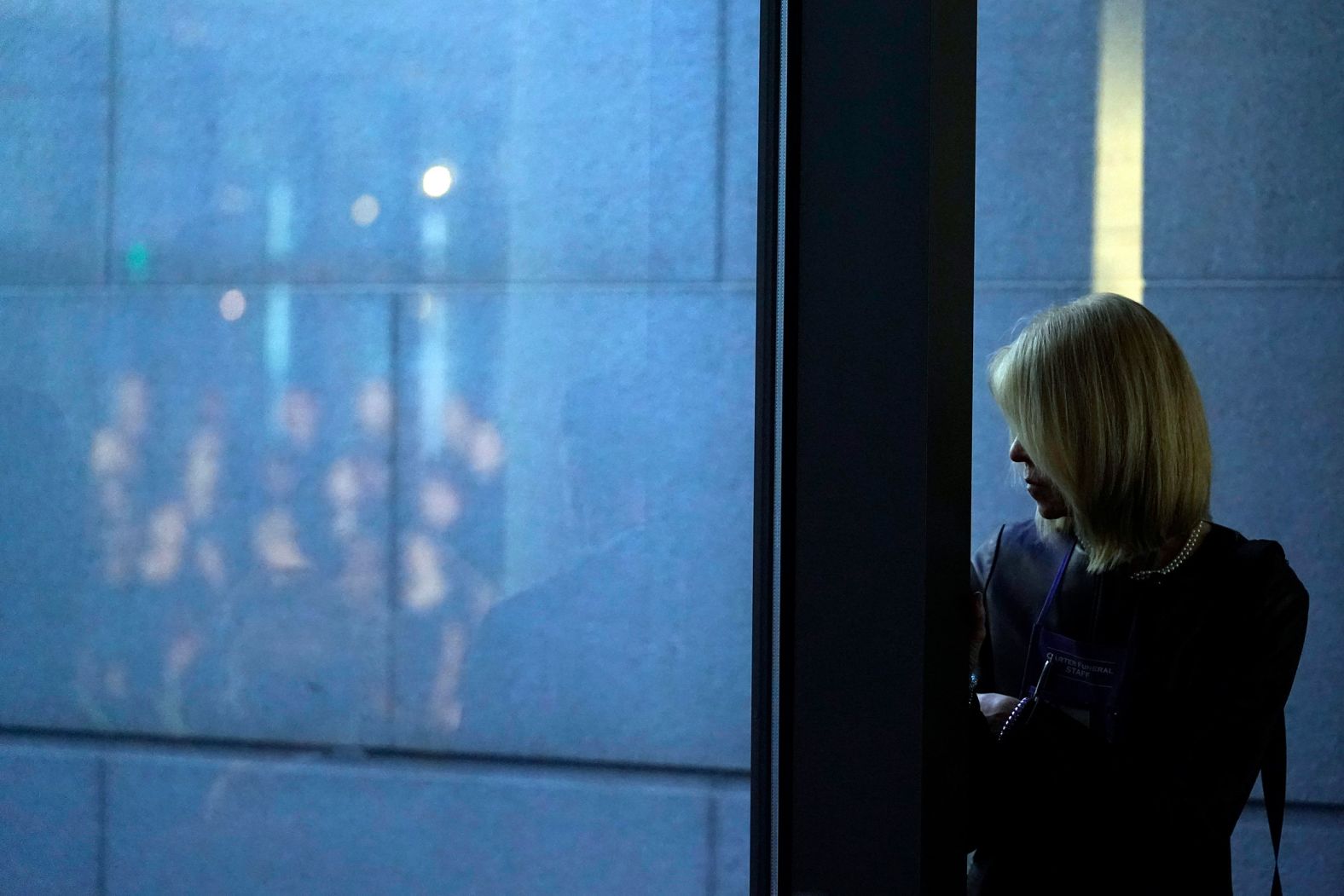 A person waits before the former first lady laid in repose Monday in Atlanta.