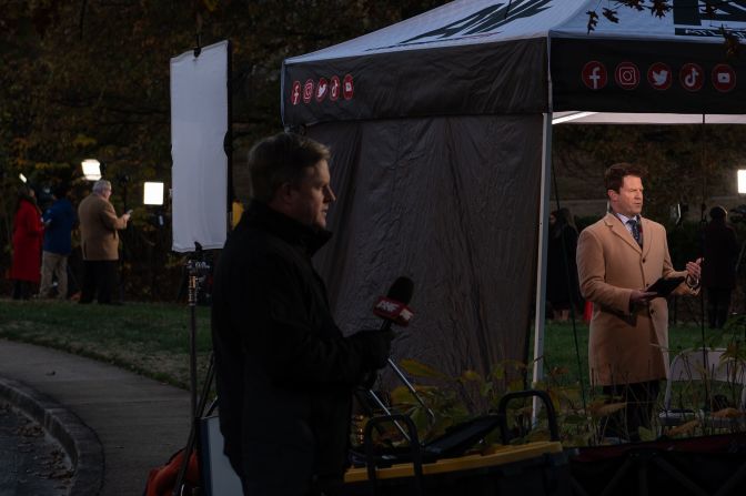 TV journalists report from outside the Carter Center in Atlanta on Monday.