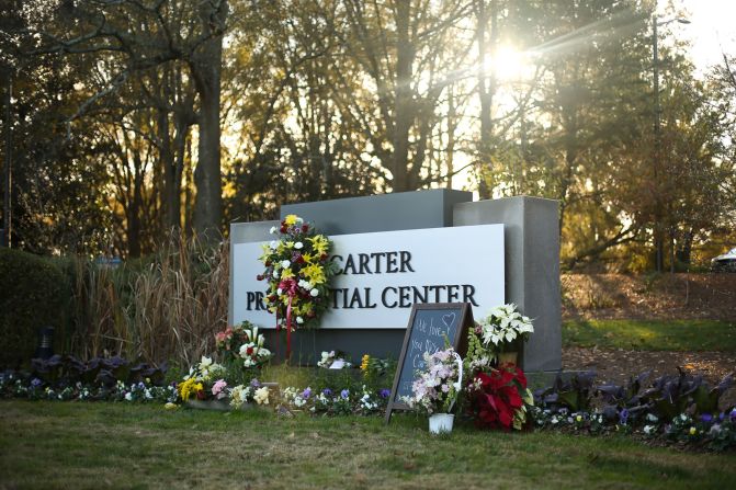Flowers are left for the former first lady outside the Carter Center on Monday.