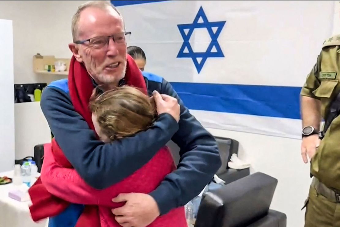 TOPSHOT - This image grab from a handout video released by the Israeli army, shows 9-year-old Irish Israeli former hostage Emily Hand embracing her father at a hospital in Israel after being released by Hamas, amid an exchange operation of hostages against prisoners between Hamas and Israel, on November 26, 2023. Hamas on November 25, released a second group of Israeli and foreign civilians it had been holding hostage in the Gaza Strip in exchange for Palestinian prisoners, after an hours-long unexpected delay set nerves on edge. Israeli authorities said 13 Israelis and four Thai citizens had returned to Israel. (Photo by Israel Army / AFP) / NO ARCHIVES -- RESTRICTED TO EDITORIAL USE - MANDATORY CREDIT "AFP PHOTO / ISRAELI ARMY" - NO MARKETING NO ADVERTISING CAMPAIGNS - DISTRIBUTED AS A SERVICE TO CLIENTS (Photo by -/Israel Army/AFP via Getty Images)