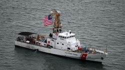 In this February 6 phtoo, a Coast Guard cutter idles near Nobska Lighthouse in Falmouth, Massachusetts.