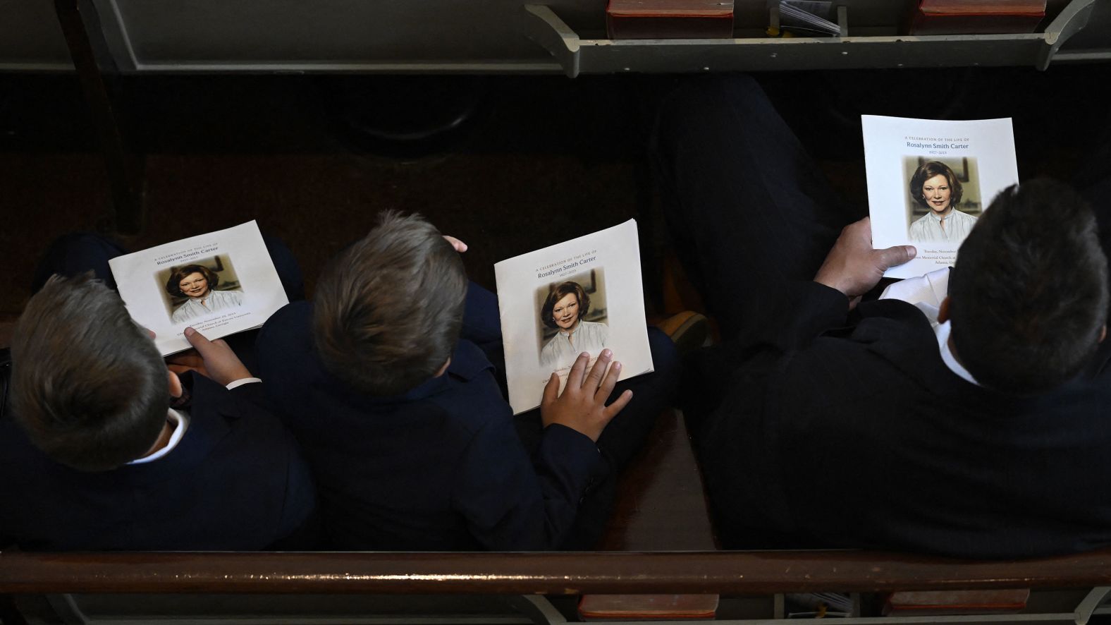 Guests hold programs before Tuesday's tribute service. Jason Carter told CNN that <a href="index.php?page=&url=https%3A%2F%2Fwww.cnn.com%2Fus%2Flive-news%2Frosalynn-carter-tribute-service-tuesday-11-28-23%2Fh_01bb3c853844ae0566edca305dc17246" target="_blank">his grandmother designed the program before she died</a>.