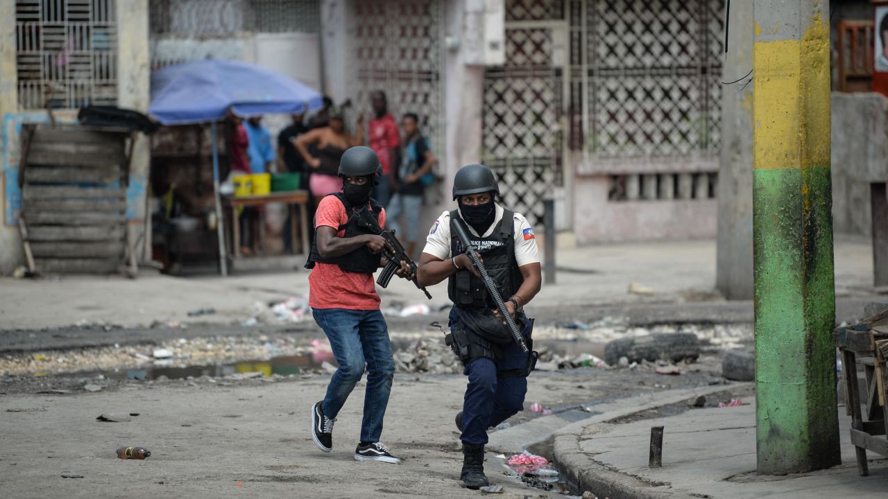 Police officers patrol a neighborhood amid gang-related violence in downtown Port-au-Prince on April 25, 2023. - Between April 14 and 19, clashes between rival gangs left nearly 70 people dead, including 18 women and at least two children, according to a United Nations statement released April 24. (Photo by RICHARD PIERRIN / AFP) (Photo by RICHARD PIERRIN/AFP via Getty Images)