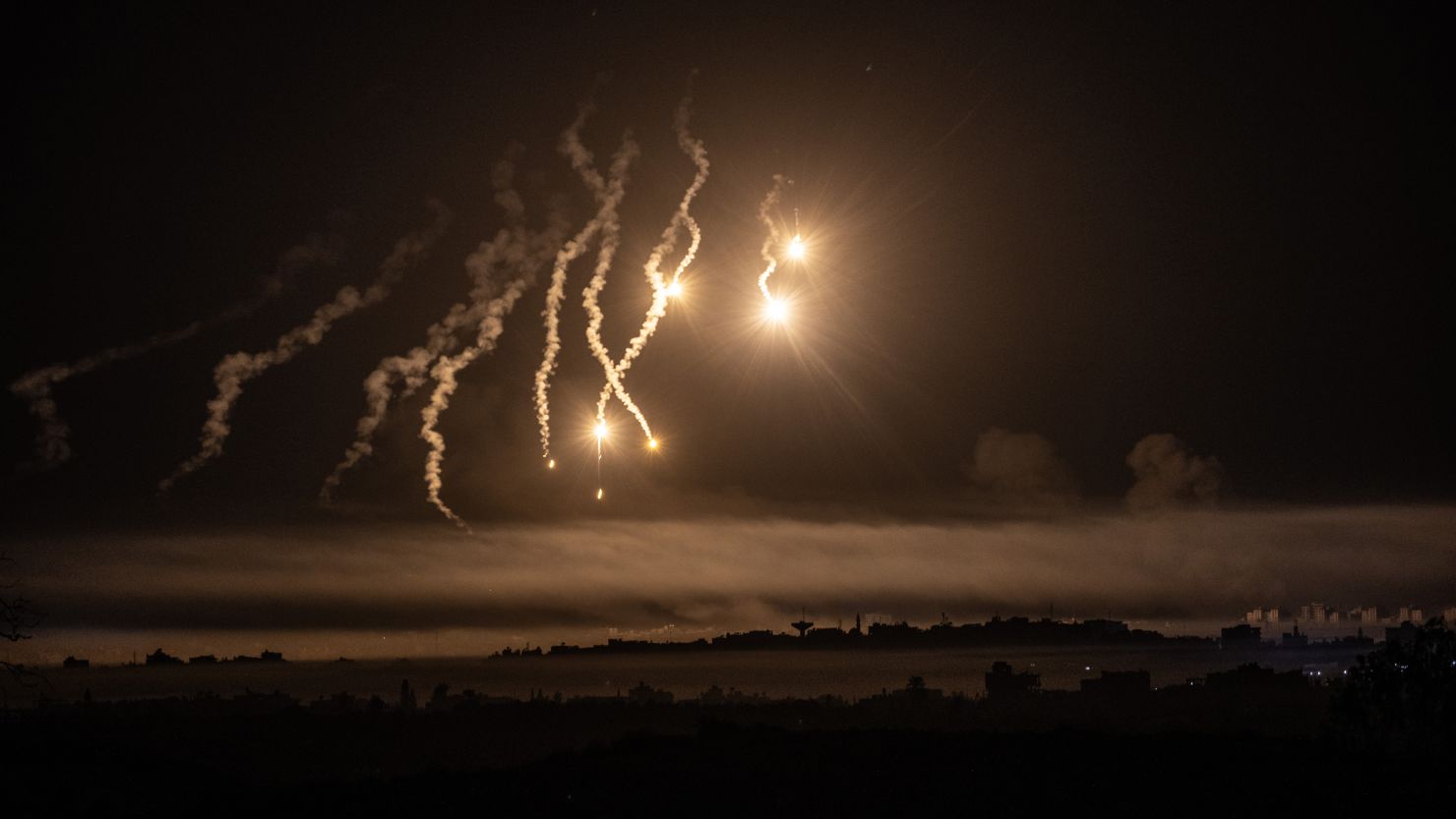 SDEROT, ISRAEL - OCTOBER 31: A lighting flare, fired by Israel forces on the northwest of Gaza, is seen from Sderot city as the Israeli airstrikes continue on 25th day, in Sderot, Israel on October 31, 2023. (Photo by Mostafa Alkharouf/Anadolu via Getty Images)