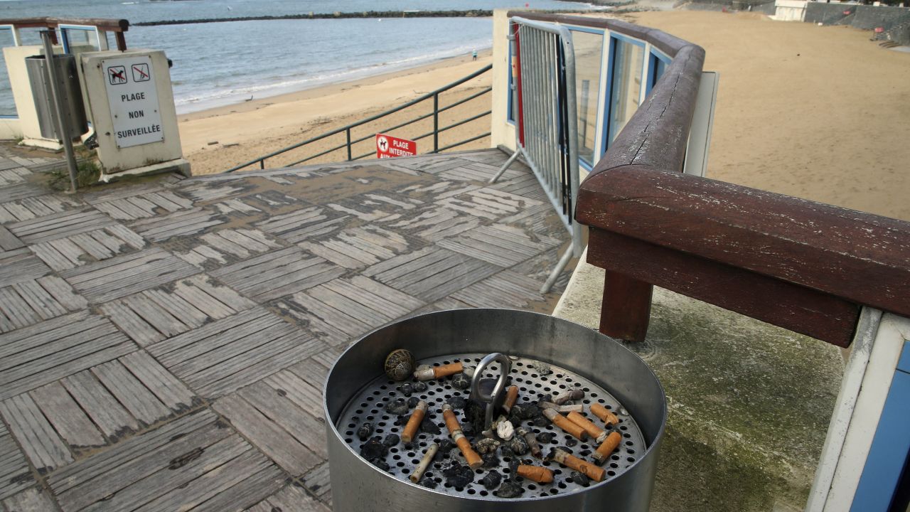 An ashtray with cigarette butts at the edge of the beach, in Saint Jean de Luz, southwestern France, Tuesday, Nov. 28, 2023. France's government plans to ban smoking on all beaches, in public parks, forests and some other public areas. The measures are part of a national anti-tobacco plan presented by the health minister, who says tobacco products cause 75,000 avoidable deaths a year in France. (AP Photo Bob Edme)