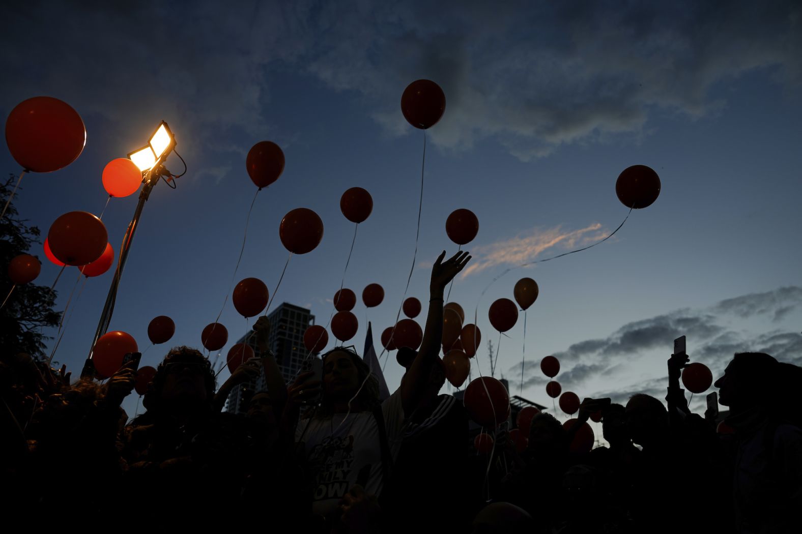 Protesters release balloons as they call for the release of the Bibas family, whose members are being held hostage in Gaza by Hamas, in Tel Aviv, Israel, on November 28.