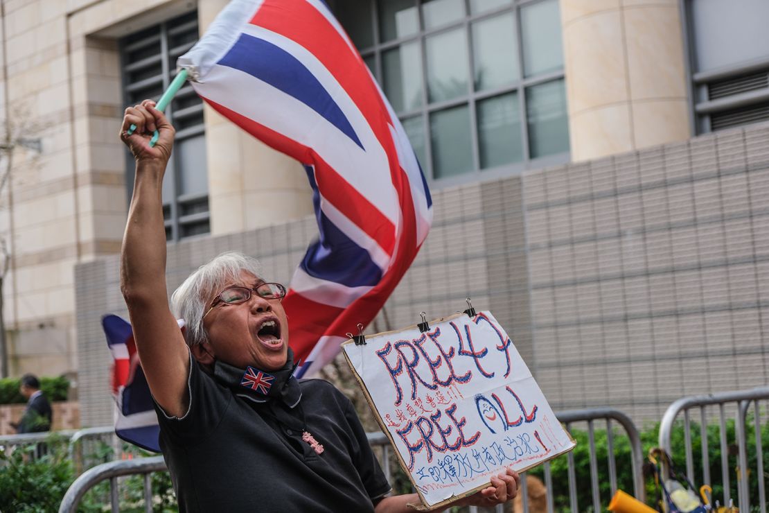 Alexandra Wong, 67, a pro-democracy activist known as Grandma Wong, waves a British Union flag outside the West Kowloon Magistrates' Courts before a landmark national security hearing in Hong Kong, on November 29, 2023.