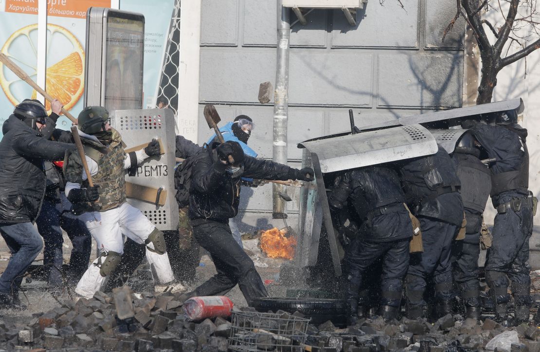 FILE - In this file photo taken on Feb. 18, 2014, anti-government protesters clash with riot police outside Ukraine's parliament in Kyiv, Ukraine. On Nov. 21, 2023, Ukraine marks the 10th anniversary of the uprising that eventually led to the ouster of the country's Moscow-friendly president. (AP Photo/Efrem Lukatsky, file)