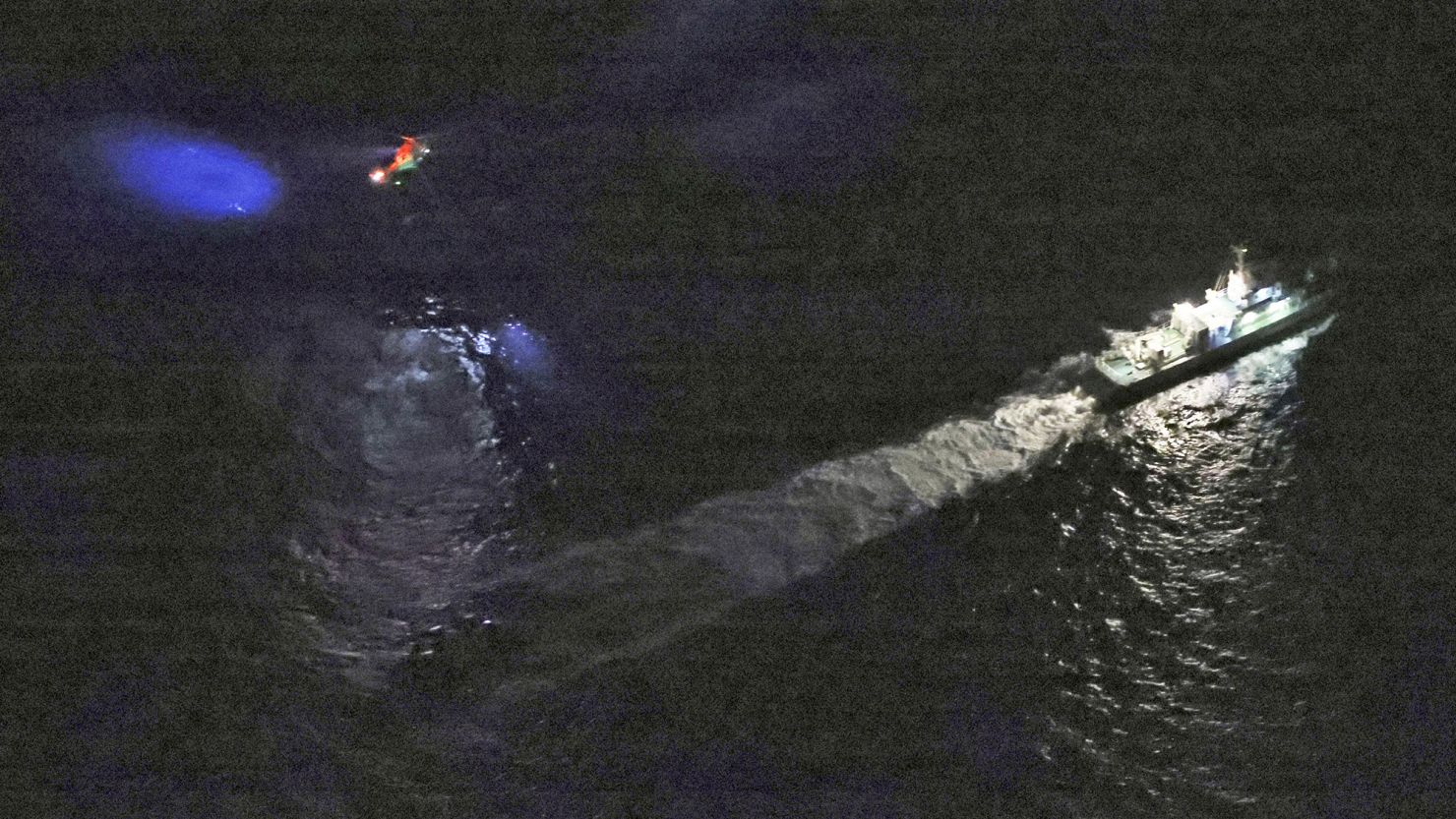 A Japan Coast Guard vessel and a helicopter conduct search and rescue operation at the site where a U.S. military aircraft MV-22 Osprey crashed into the sea off Yakushima Island, Kagoshima prefecture, western Japan November 29, 2023, in this photo taken by Kyodo. Mandatory credit Kyodo via REUTERS ATTENTION EDITORS - THIS IMAGE WAS PROVIDED BY A THIRD PARTY. MANDATORY CREDIT. JAPAN OUT. NO COMMERCIAL OR EDITORIAL SALES IN JAPAN
