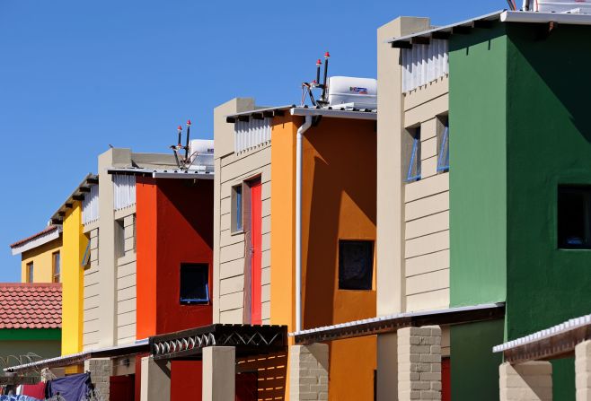South African architect Luyanda Mpahlwa has been a key figure in the design world for more than three decades. With his own personal history of social activism, he incorporates inclusive design into his projects. Pictured: Mpahlwa's work for the 10x10 Indaba Housing Project in Cape Town's Mitchell's Plain Township, which won the US-based Curry Stone Design prize in 2008. The colorful design used indigenous building practices to keep costs low.