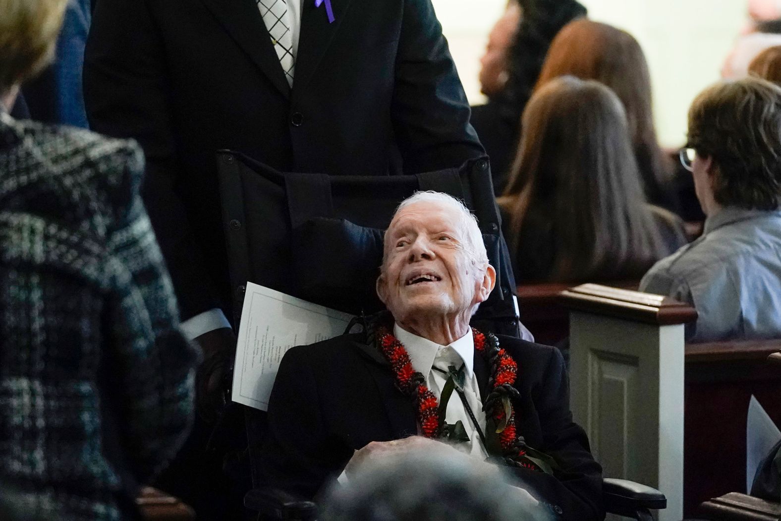 Former President Jimmy Carter greets people after his wife's funeral service on Wednesday.
