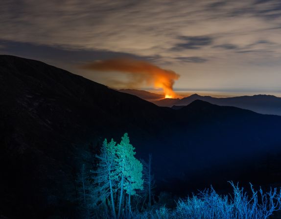 The element of fire is personal to Cooley, having nearly lost his home to one in 2017. Pictured: the Los Angeles County Bobcat Fire burns in the distance. It was one of many in 2020 that made the year the largest recorded wildfire season in California's history. Cooley aims to make these disasters "almost beautiful," he said, "(because) that's how you can bring attention to them."