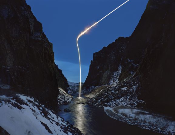 Cooley's 2009 photo series "Light's Edge" provides desolate views of American landscapes illuminated by "eerie distress signals, possibly messages from above or vice-versa," he said.