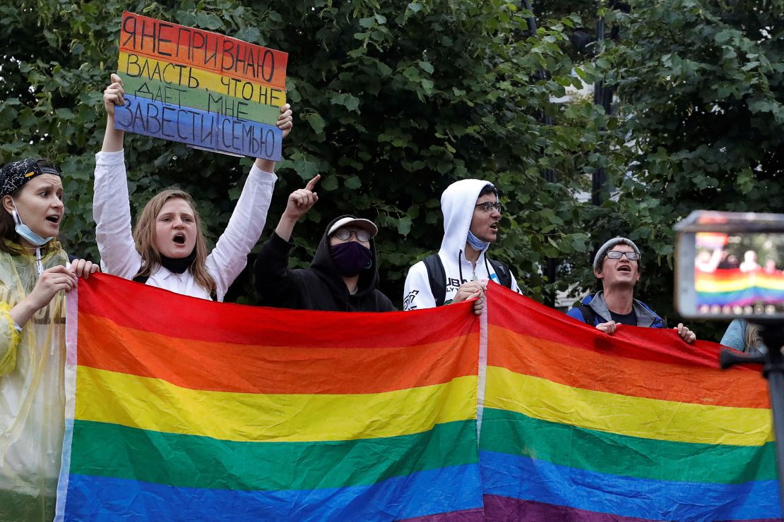 FILE PHOTO: LGBT activists take part in a protest against amendments to Russia's Constitution and the results of a nationwide vote on constitutional reforms, in Moscow, Russia July 15, 2020. The placard reads: "I don't recognise the authority that keeps me from having a family". REUTERS/Shamil Zhumatov/File Photo
