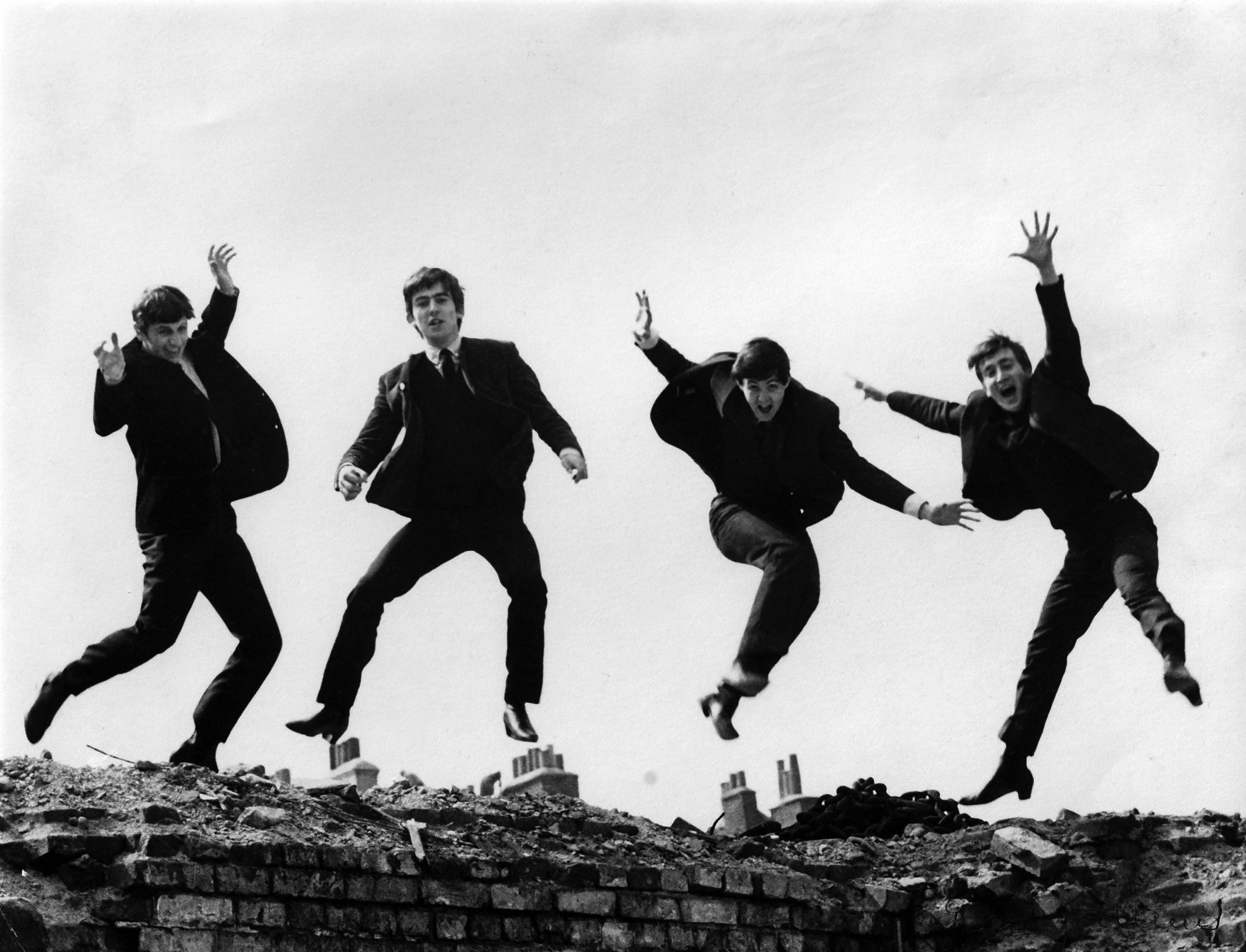 Photo of the Beatles, April 1963; L-R: Ringo Starr, George Harrison, Paul McCartney, John Lennon - posed, group shot - jumping on wall, Used on the Twist & Shout EP cover.