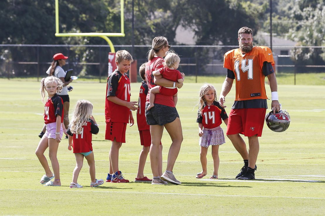TAMPA, FL - JULY 28: Quarterback Ryan Fitzpatrick #14 of the Tampa Bay Buccaneers is greeted by his entire family after Training Camp at One Buc Place on July 28, 2018 in Tampa, Florida. (Photo by Don Juan Moore/Getty Images)