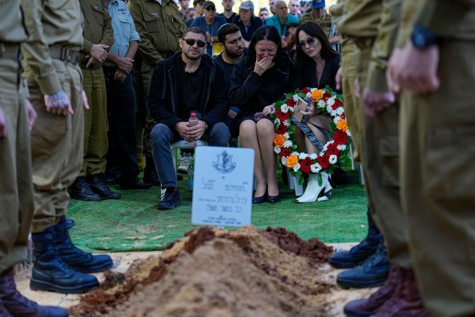 Viktor and Helena Brodski mourn during a memorial service for their son, Sgt. Kiril Brodski at the Kiryat Shaul military cemetery in Tel Aviv, Israel, on November 29.