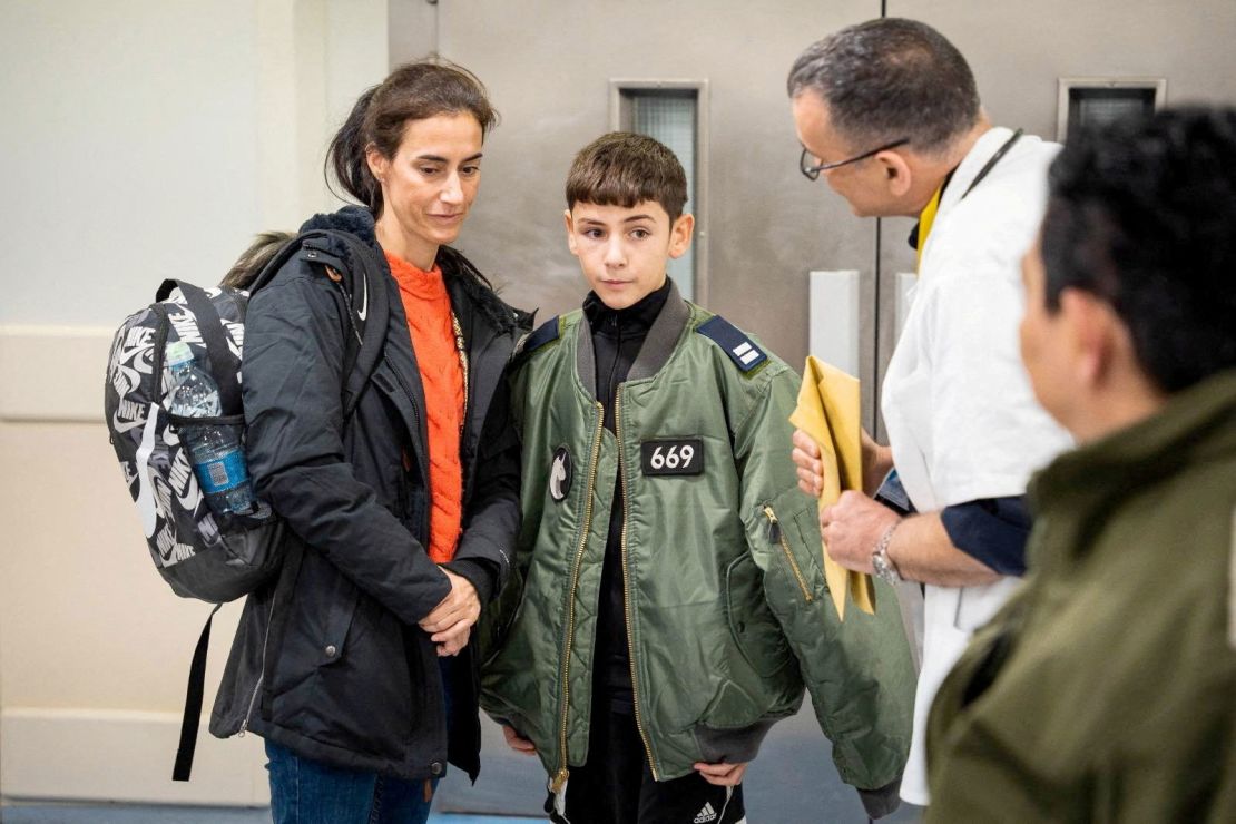 Eitan Yahalomi, 12, who was released from the Gaza Strip on November 27 after being taken hostage by the Palestinian militant group Hamas during the October 7 attack on Israel, is accompanied at Sourasky Medical Center (Ichilov) in Tel Aviv, Israel, in this handout picture released by Israeli Prime Minister's Office of Israel on November 28, 2023. Israeli Defense Forces/Handout via REUTERS THIS IMAGE HAS BEEN SUPPLIED BY A THIRD PARTY