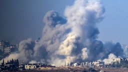 This picture taken from southern Israel near the border with the Gaza Strip shows smoke rising from buildings after being hit by Israeli strikes, as battles resume between Israel and Hamas militants, on December 1, 2023. A temporary truce between Israel and Hamas expired on December 1, with the Israeli army saying combat operations had resumed, accusing Hamas of violating the operational pause. (Photo by John MACDOUGALL / AFP) (Photo by JOHN MACDOUGALL/AFP via Getty Images)